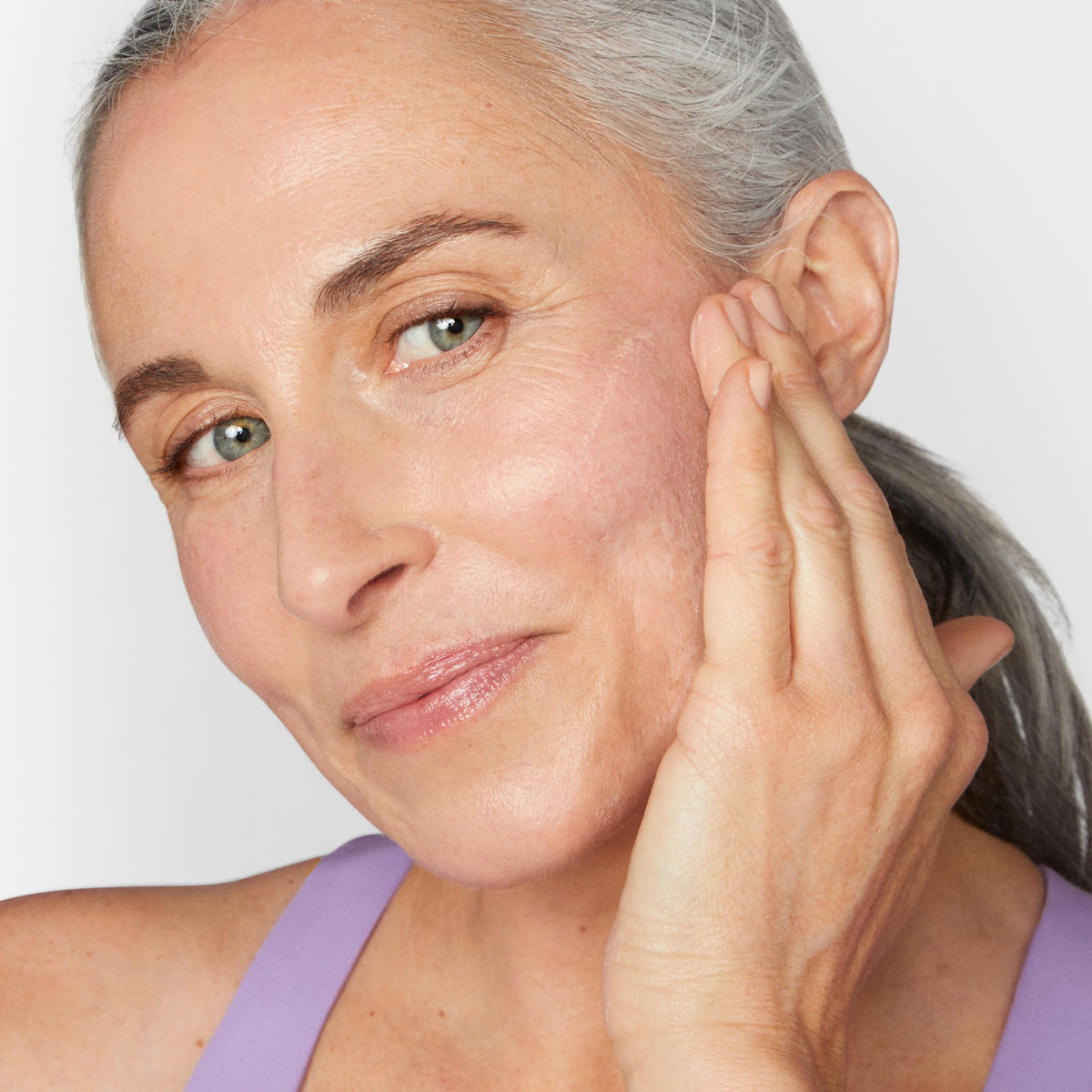Clinique applying cream on hand, brand demonstrates instant plumping benefit