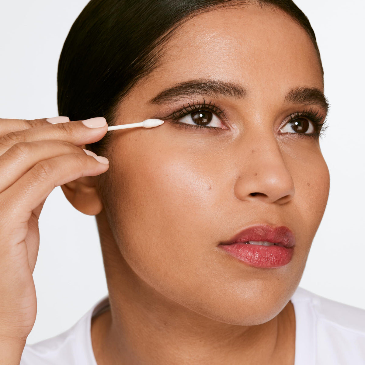 Clinique on cotton pad removing mascara for precise touch-up benefit