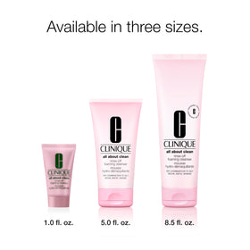 Clinique bottle next to hand for size comparison and portability benefit