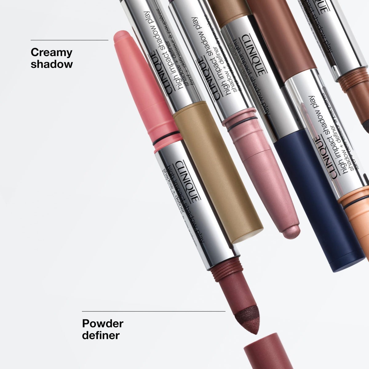 Clinique stick beside small brush to show compact size and portability