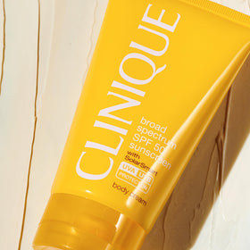 Clinique SPF 50 body cream texture close-up highlighting lightweight oil-free finish for comfort