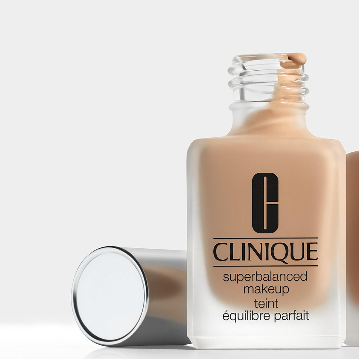 Clinique Superbalanced applied on model’s cheek, demonstrating natural finish and shine control