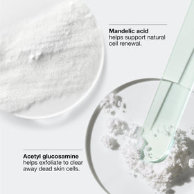 Clinique bottle in hand showing 1 fl oz scale for clear size reference