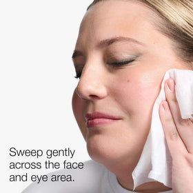 Clinique wipe removing eye makeup in use for quick, no-water cleansing