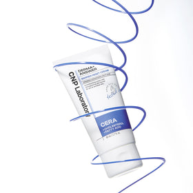 CNP Barrier Reset Cream small jar with measuring spoon showing portion control and travel convenience