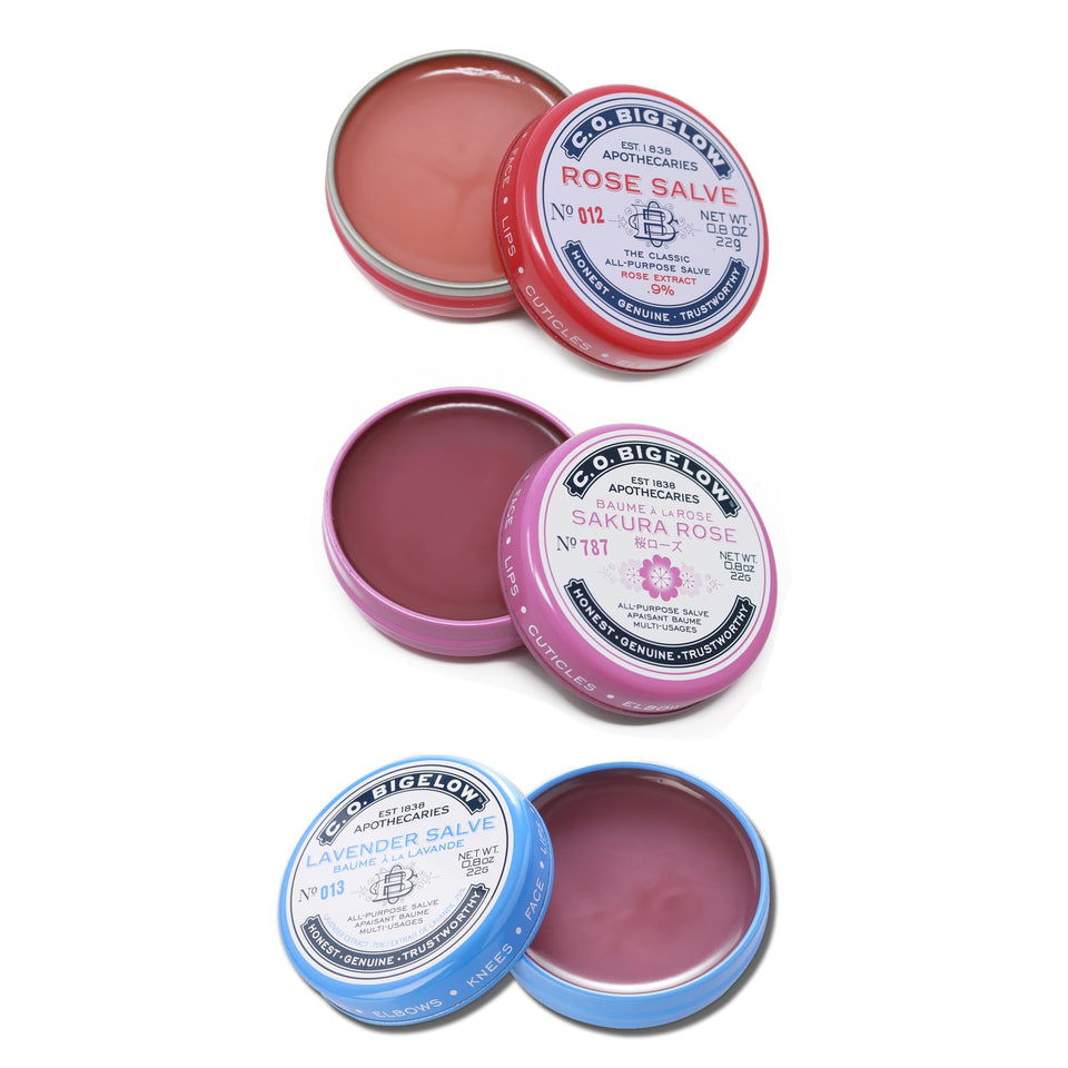 C. O. Bigelow front view of three salve tins showing scents and packaging benefits