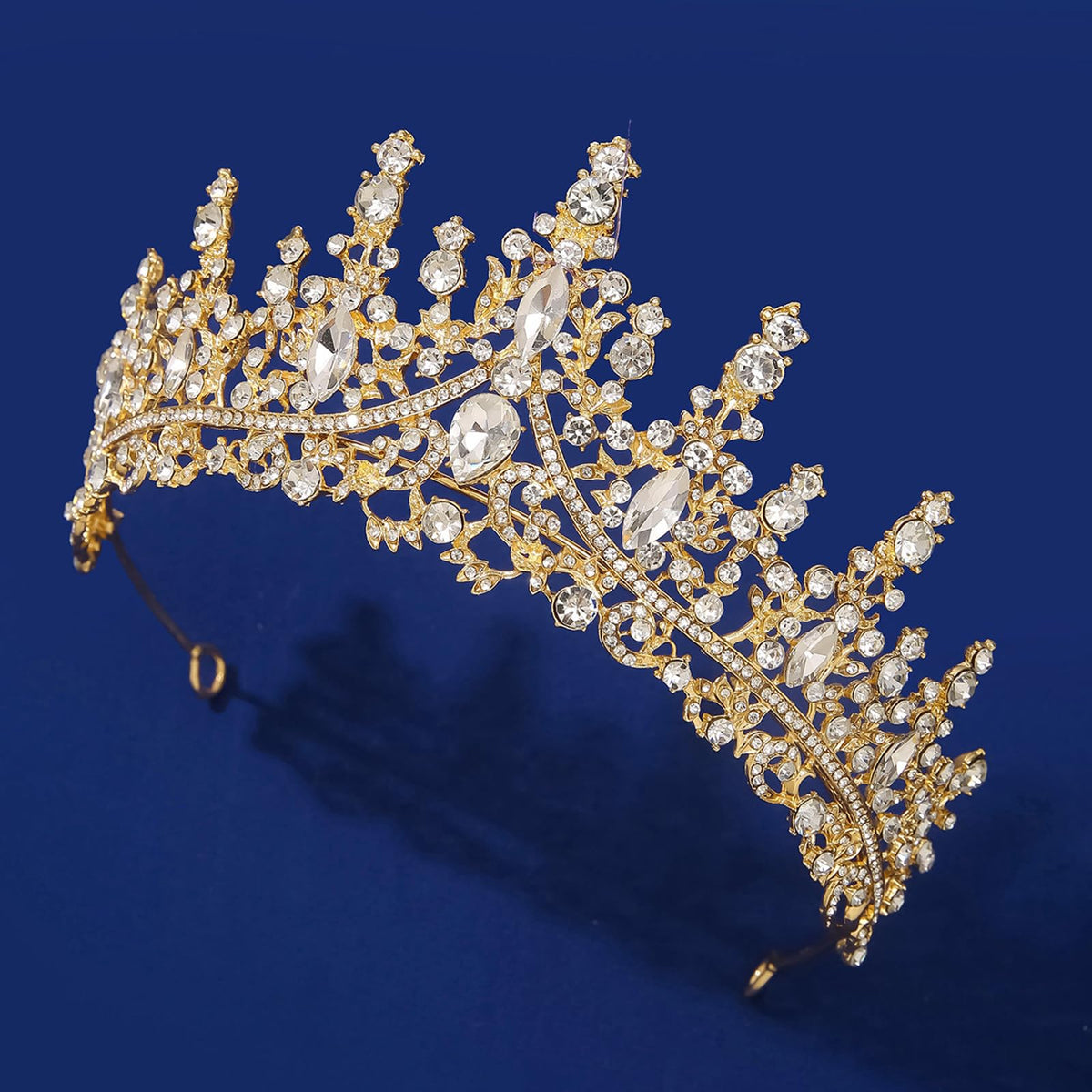 COCIDE tiara held in hand for scale showing compact, wearable size
