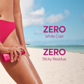 Coco & Eve bottle styled on towel conveying beach-ready protection