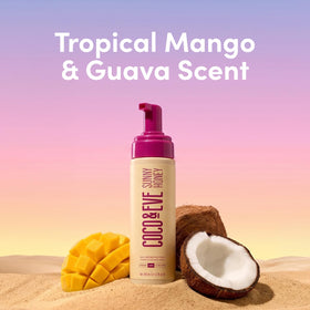 Coco & Eve bottle staged with tropical props conveying vacation fragrance