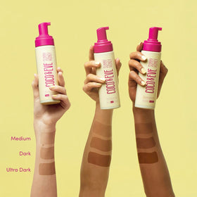 Coco & Eve tanning mitt and kabuki brush flatlay for precise, mess-free application