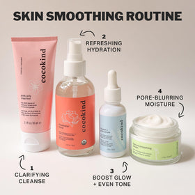 Cocokind bottle staged with fresh roses conveying natural hydrosol benefits