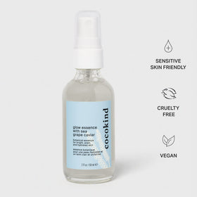 Droplet of Glow Essence on skin revealing lightweight texture and immediate dewy finish