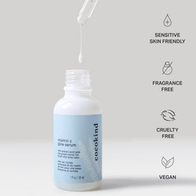 Cocokind 1 fl oz bottle held in hand to show scale and travel-friendly convenience