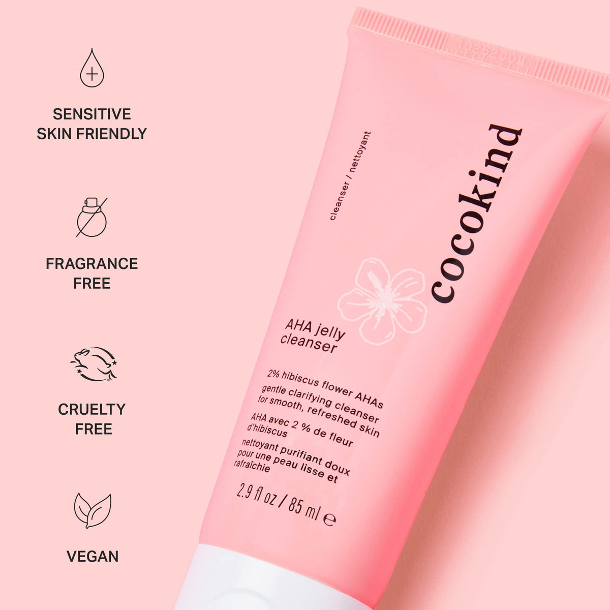 Cocokind tube next to common items for scale, shows travel-friendly size