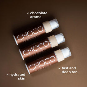 COCOSOLIS CHOCO applied on legs at beach demonstrating tanning use