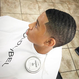 COLDLABEL hand scooping pomade illustrating effortless application benefit