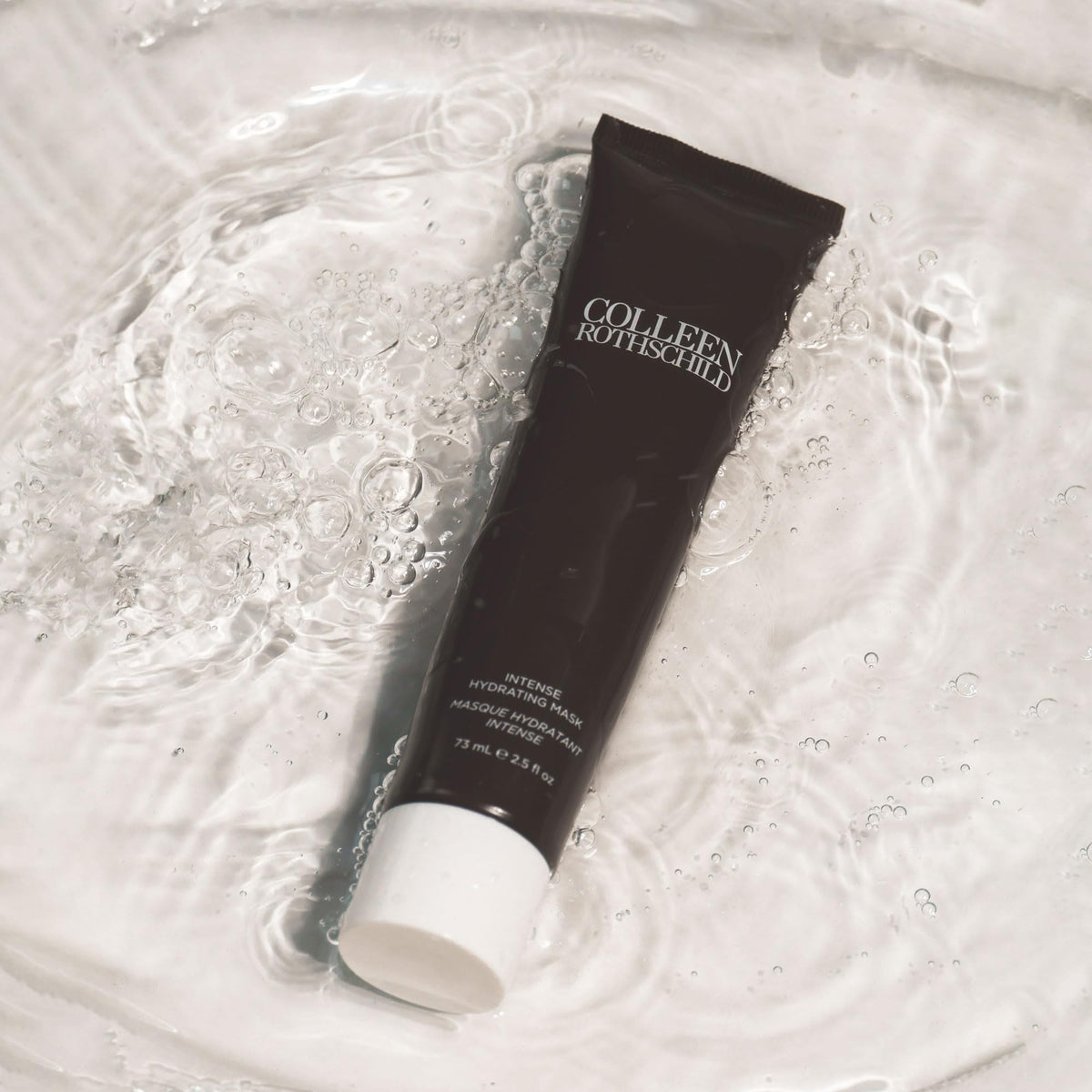 COLLEEN ROTHSCHILD applying mask to face for deep overnight hydration