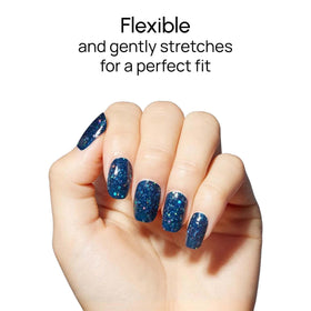 Color Street Oceans Apart on model hands demonstrating dramatic navy glitter look