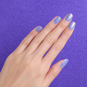 Color Street hand holding strips for scale and easy application benefit