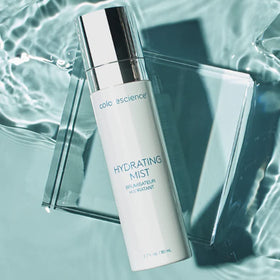 Colorescience bottle in travel pouch on a suitcase showing on-the-go hydration convenience