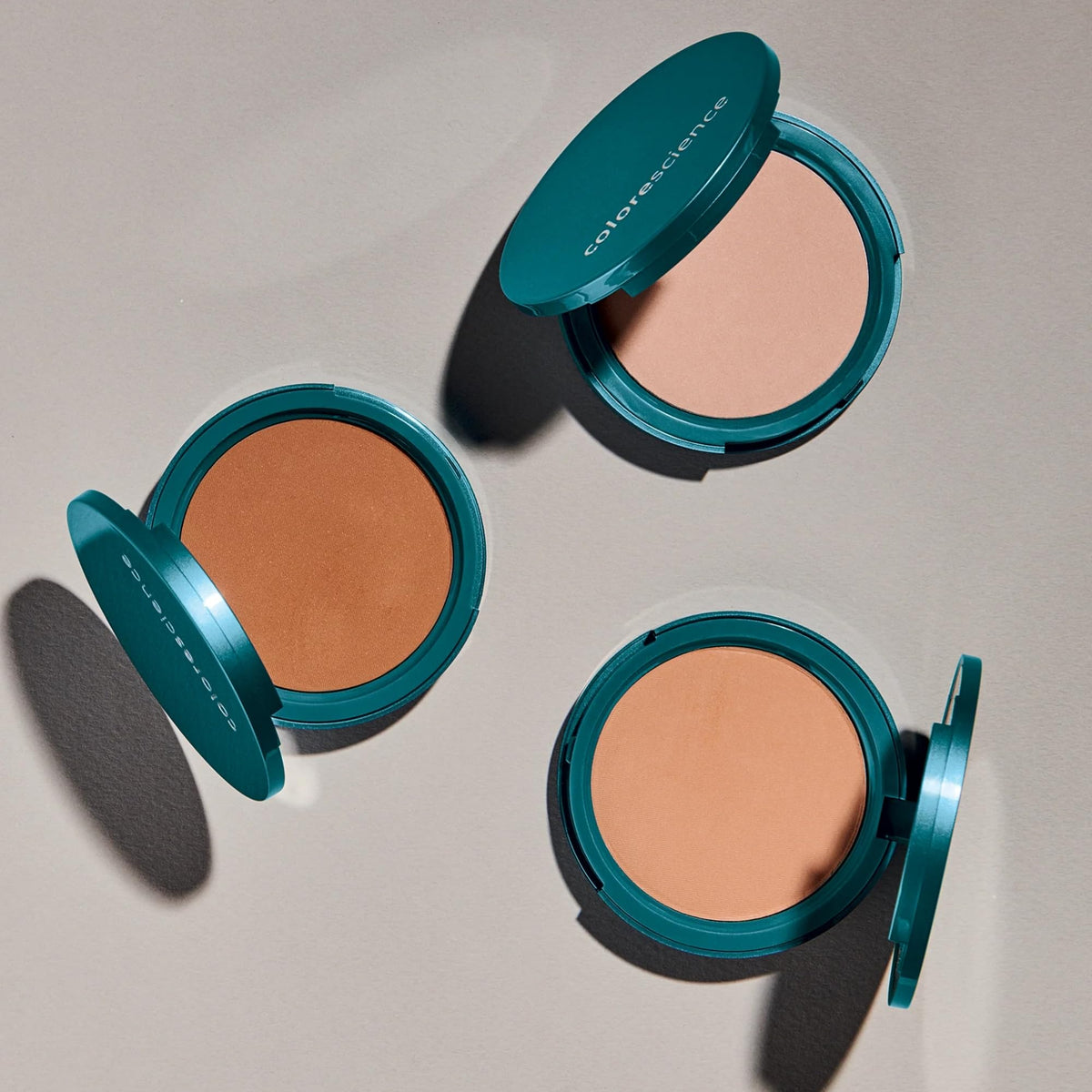 Colorescience compact beside a coin showing size and travel-friendly benefit