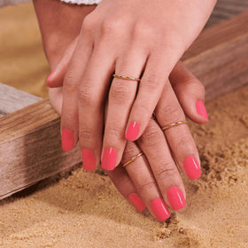 Color Street strip held in hand to show scale and how double-ended design offers better sizing