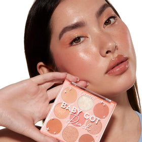 ColourPop baby got peach swatches on arm displaying pigment payoff and color range