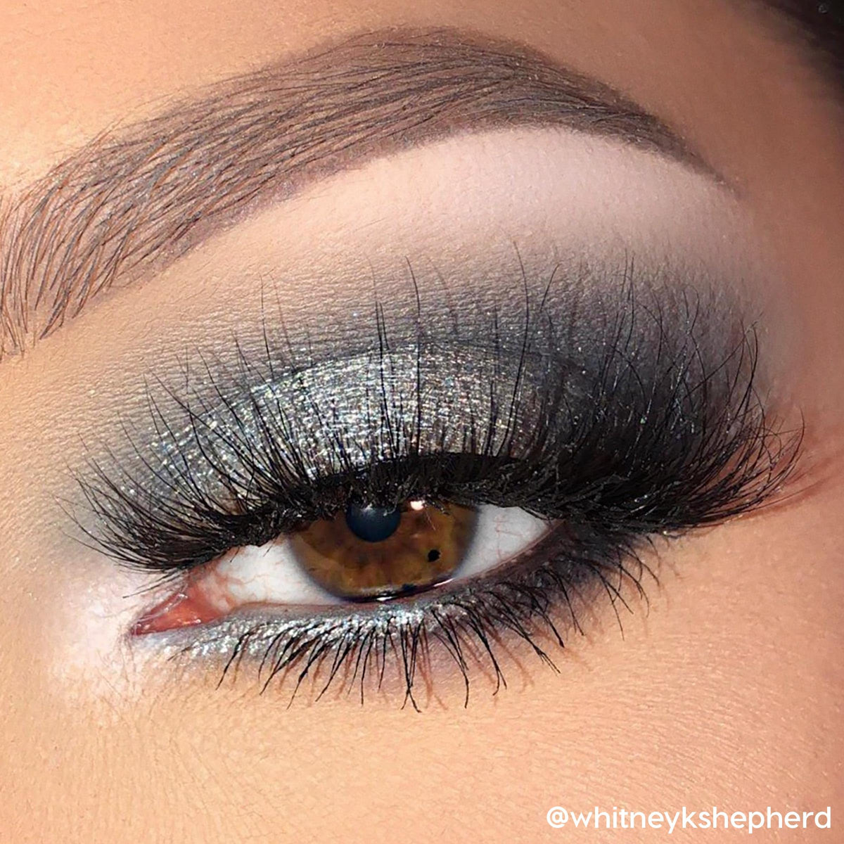 Application with brush using ColourPop shades producing a seamless smokey eye