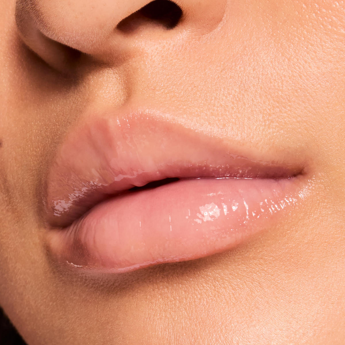ColourPop application on lips showing sheer vanilla tint and luminous shine benefit