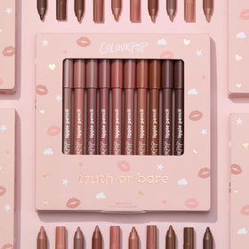 ColourPop pencil held in hand for size comparison, indicating portable convenience