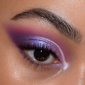 ColourPop metallic violet swatch on skin illustrating high-shimmer payoff and depth