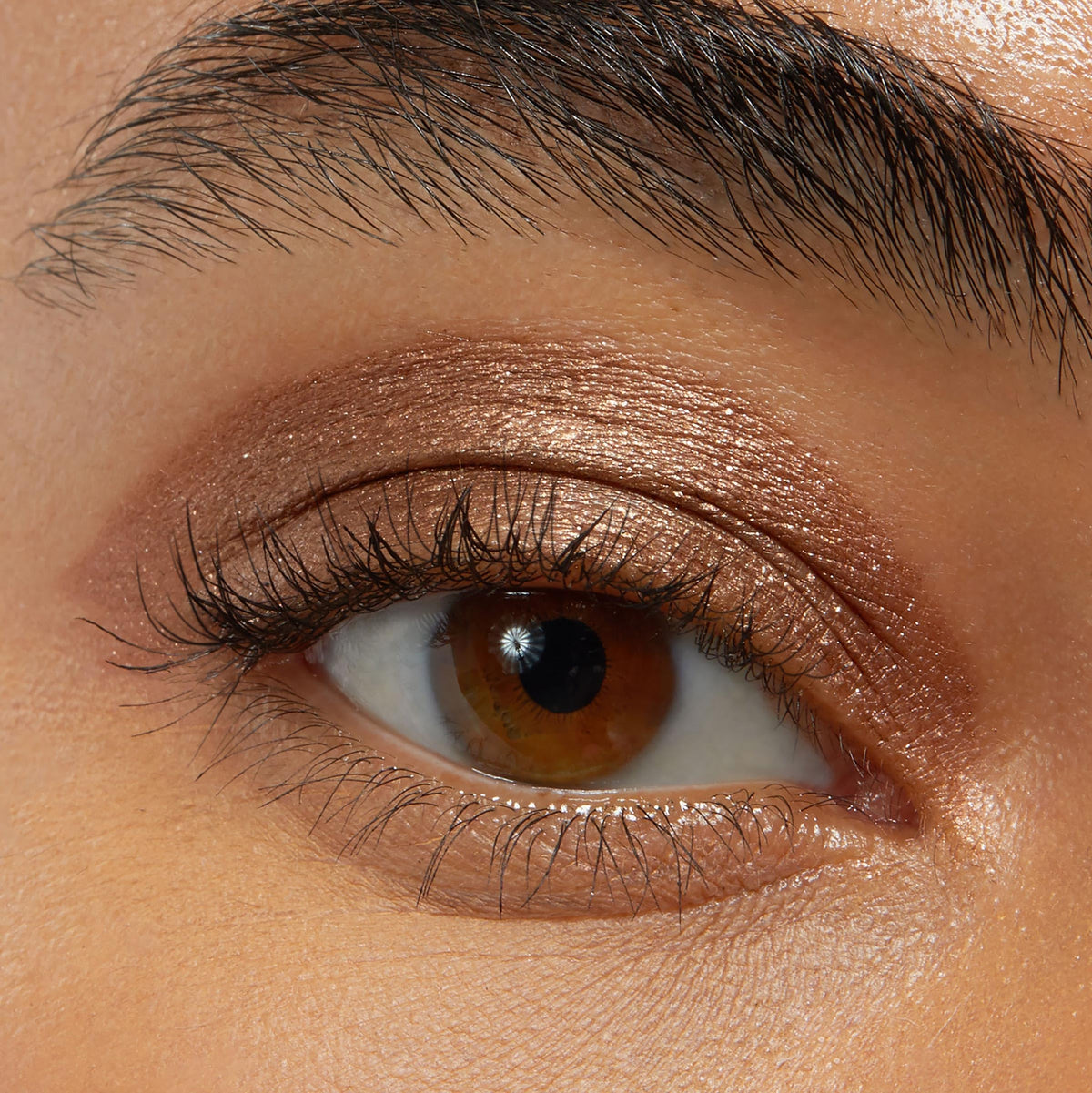 ColourPop stick applied on eyelid in hand, fast on-the-go makeup