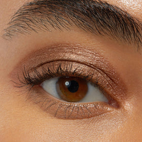 ColourPop stick applied on eyelid in hand, fast on-the-go makeup