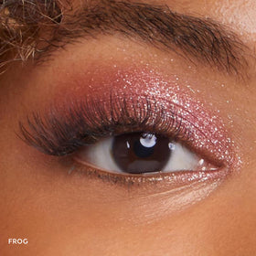 ColourPop Frog swatch on skin revealing icy baby pink frost and luminous effect