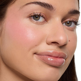 ColourPop x Stitch fingertip applying blush, demonstrates easy fingertip application and natural flush