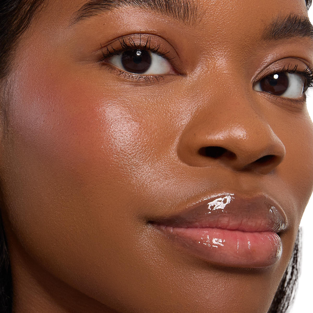ColourPop x Stitch brush applying blush to cheek, shows buildable color and seamless blending