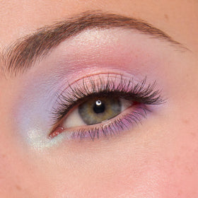 ColourPop worn on model lid demonstrating blendability and color impact