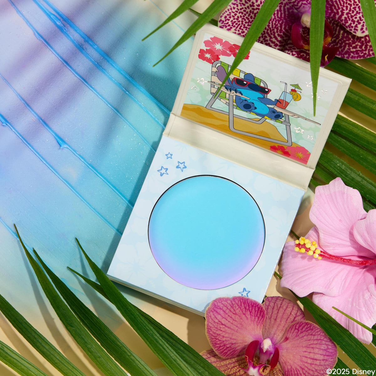 ColourPop x Stitch lifestyle flatlay with accessories, evokes travel-friendly, everyday cosmetic use