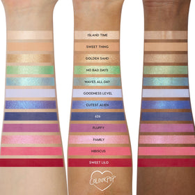 ColourPop palette beside hand to show compact size and travel convenience