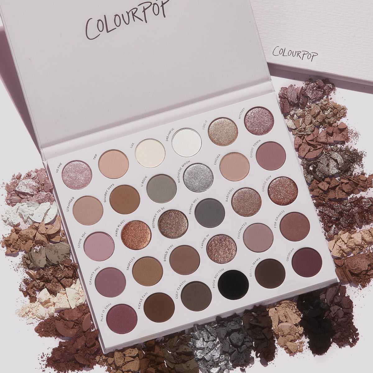 ColourPop palette in hand for scale showing compact travel-friendly benefit