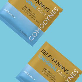 Comodynes wipes held in hand to show size and convenient travel-ready pack