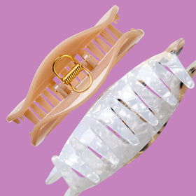 Conair clips next to ruler showing size and large-section capacity