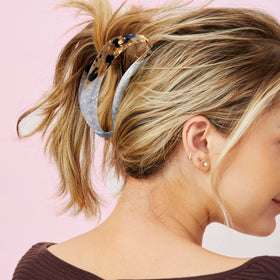 Conair clip tortoise finish securing an updo with stylish texture