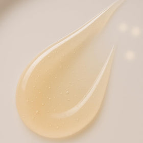 Consult Beaute macro of colloidal gold flecks in serum emphasizing luminous skin benefit
