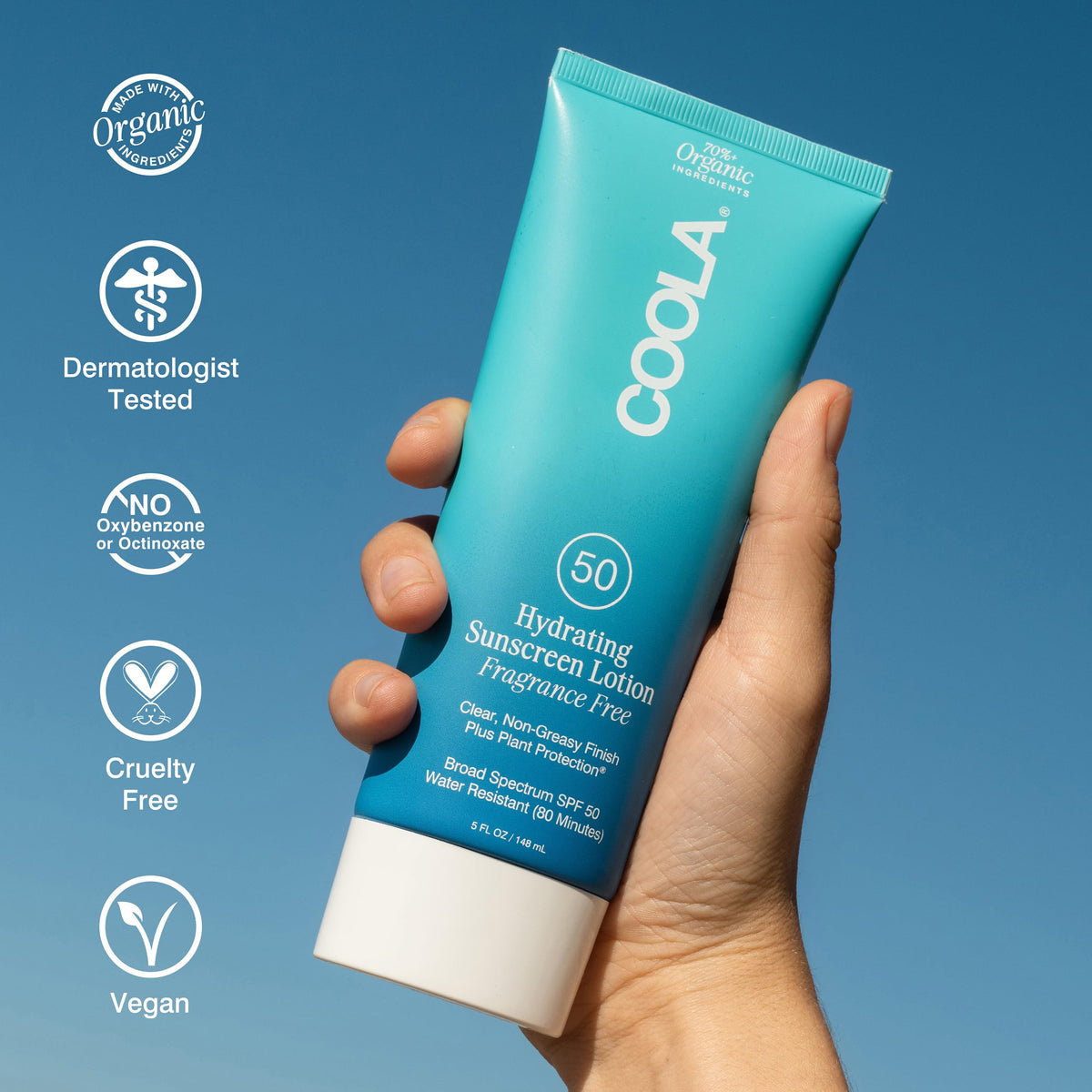 COOLA bottle next to ruler for 5 fl oz size reference and portability