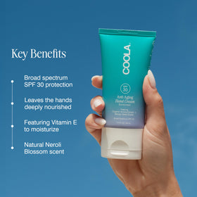 COOLA applying hand cream demonstrating smooth, protective finish