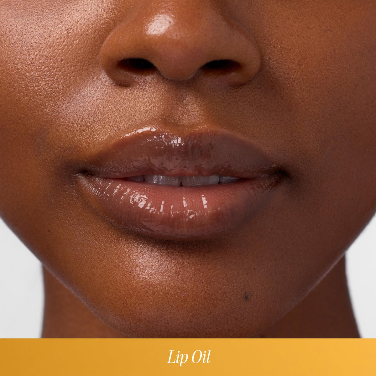 COOLA Liplux applied on lips demonstrating hydration and shine