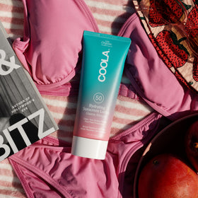 COOLA applied on forearm revealing non-greasy radiant finish benefit