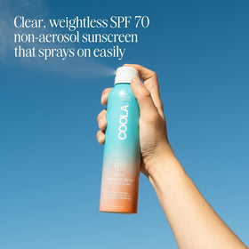 COOLA spray nozzle closeup demonstrating easy application benefit