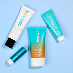 COOLA pouch open in hand showing TSA-friendly size and portability benefit